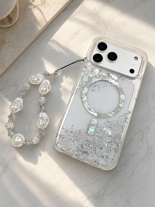 Glitter phone case with pearl bracelet charm on marble