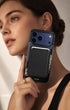 Woman holding iPhone with classic black phone wallet