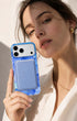 Woman holding iPhone with blue lavender phone wallet