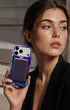 Woman in black blazer holding dark cherry phone wallet