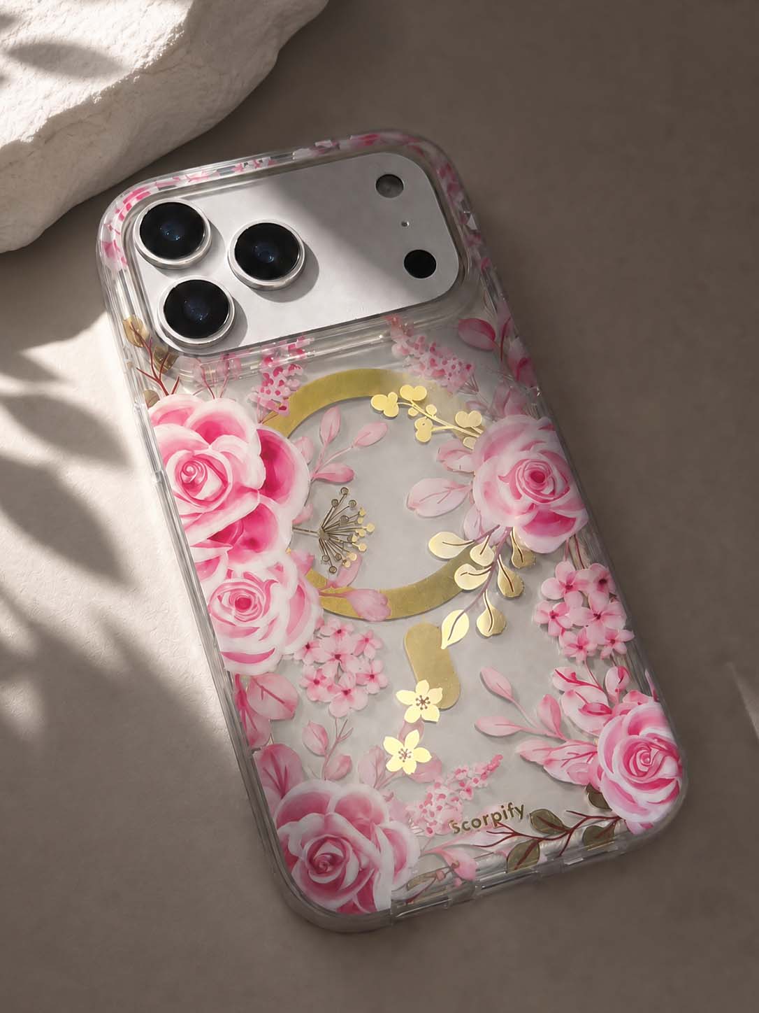 Layered floral phone case with gold-tone finishing and botanical ink texture