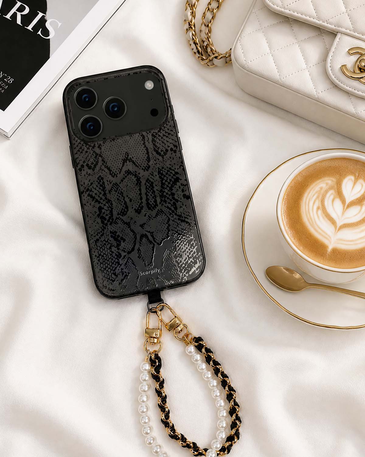 Beaded phone charm with black leather accents