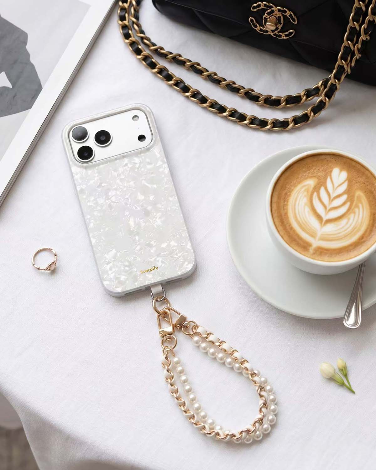 Beaded phone charm with white leather accents
