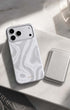 Metallic silver phone wallet with marble-pattern iPhone case