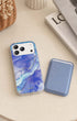 Blue lavender phone wallet beside marble-pattern iPhone case