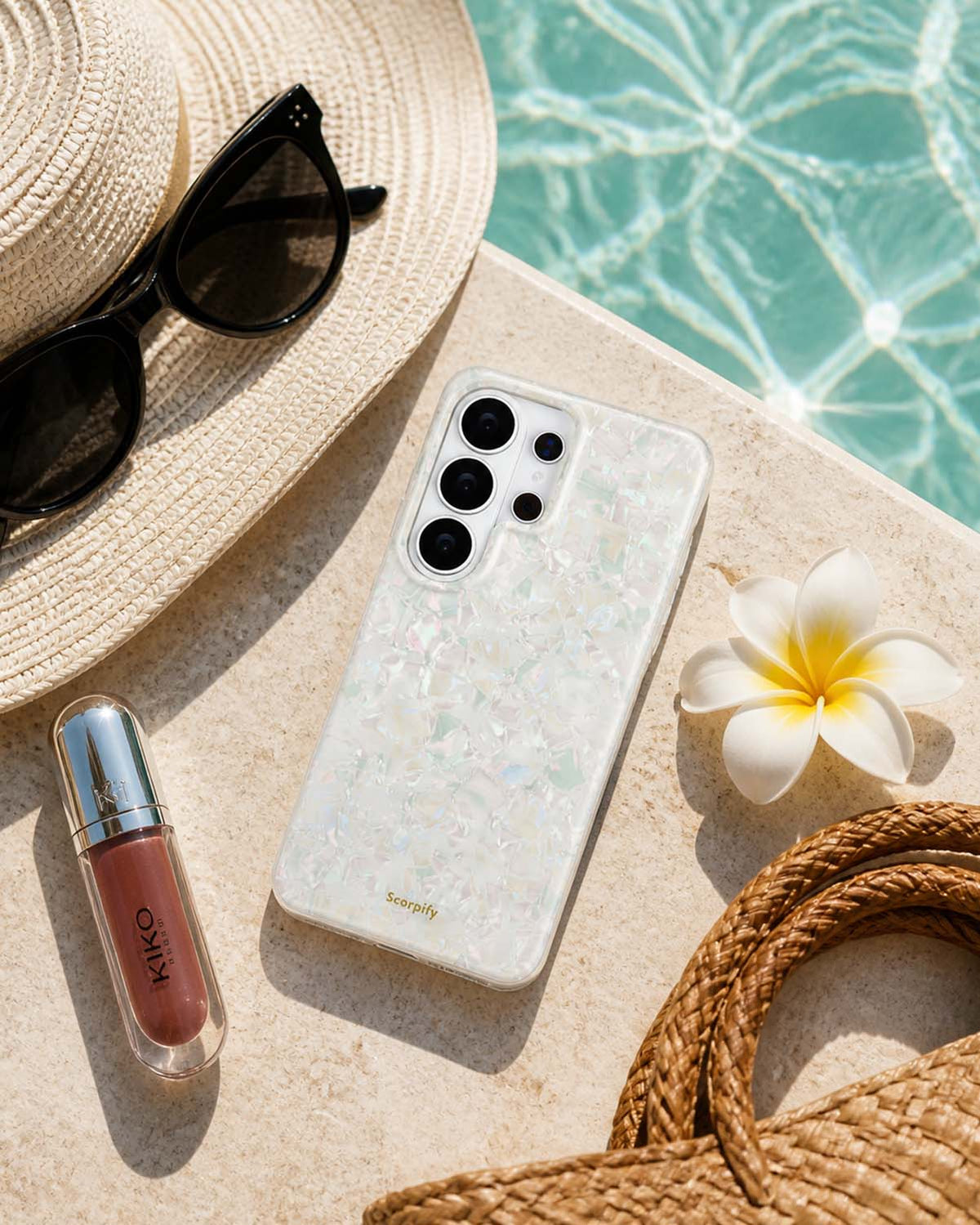 Colorful Pearl Samsung phone case on beach with sunhat and flower