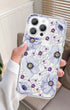 Clear MagSafe iPhone case with purple anemone florals