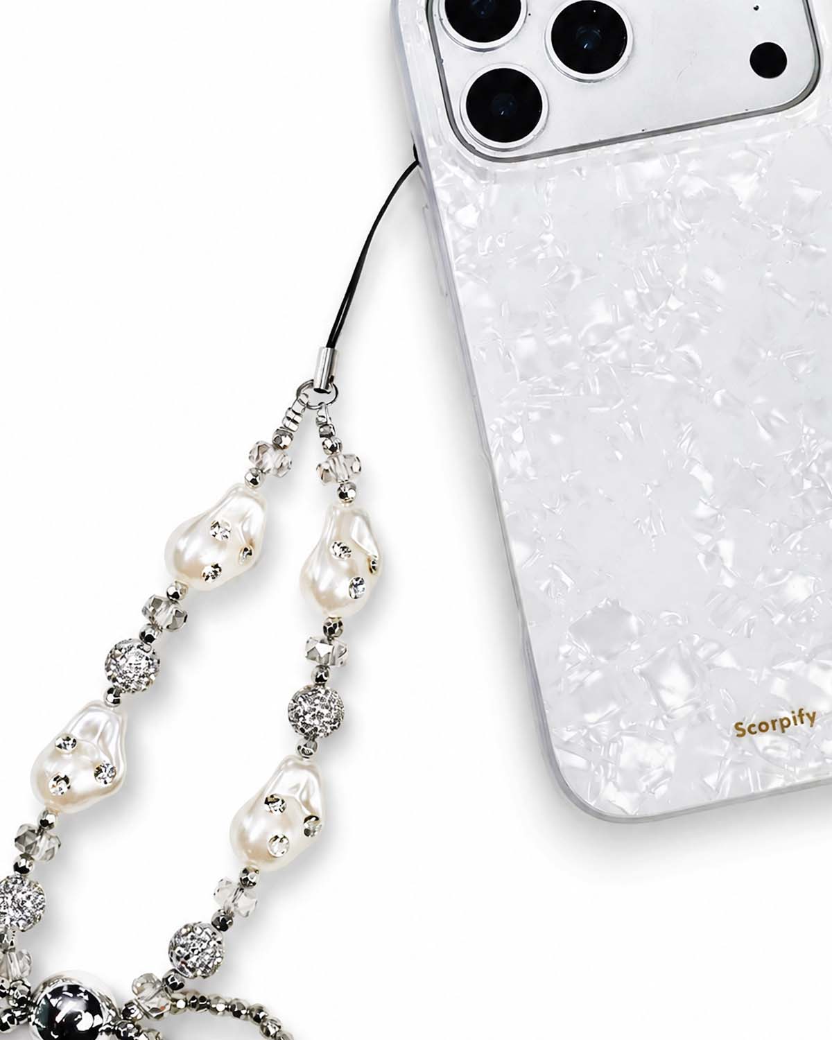 Beaded phone charm featuring pearls and bow accents