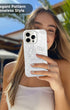 Woman holding elegant white pearl phone case, palm trees