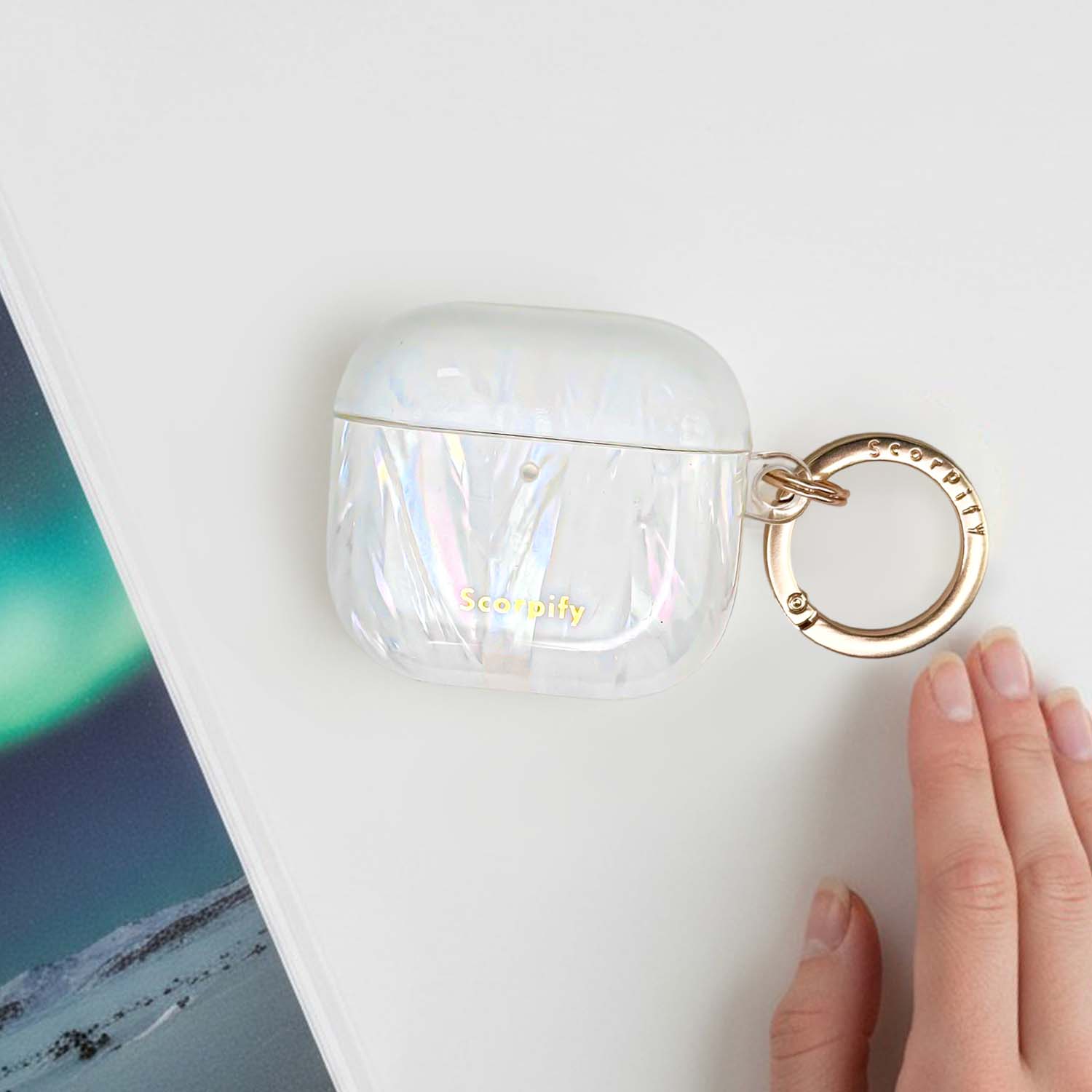 Luminous earbuds case featuring sculpted spine detail
