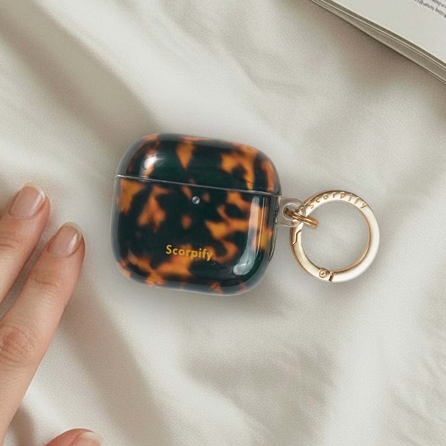 Elegant earbuds case inspired by traditional tortoise shell
