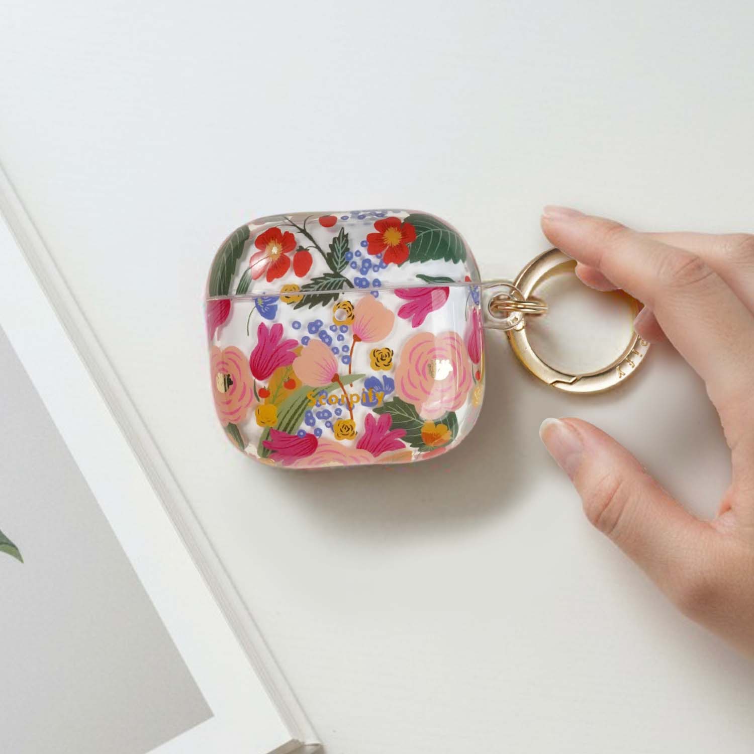 Elegant earbuds case featuring camellia bloom artwork