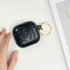 Minimal earbuds case featuring subtle snake detailing