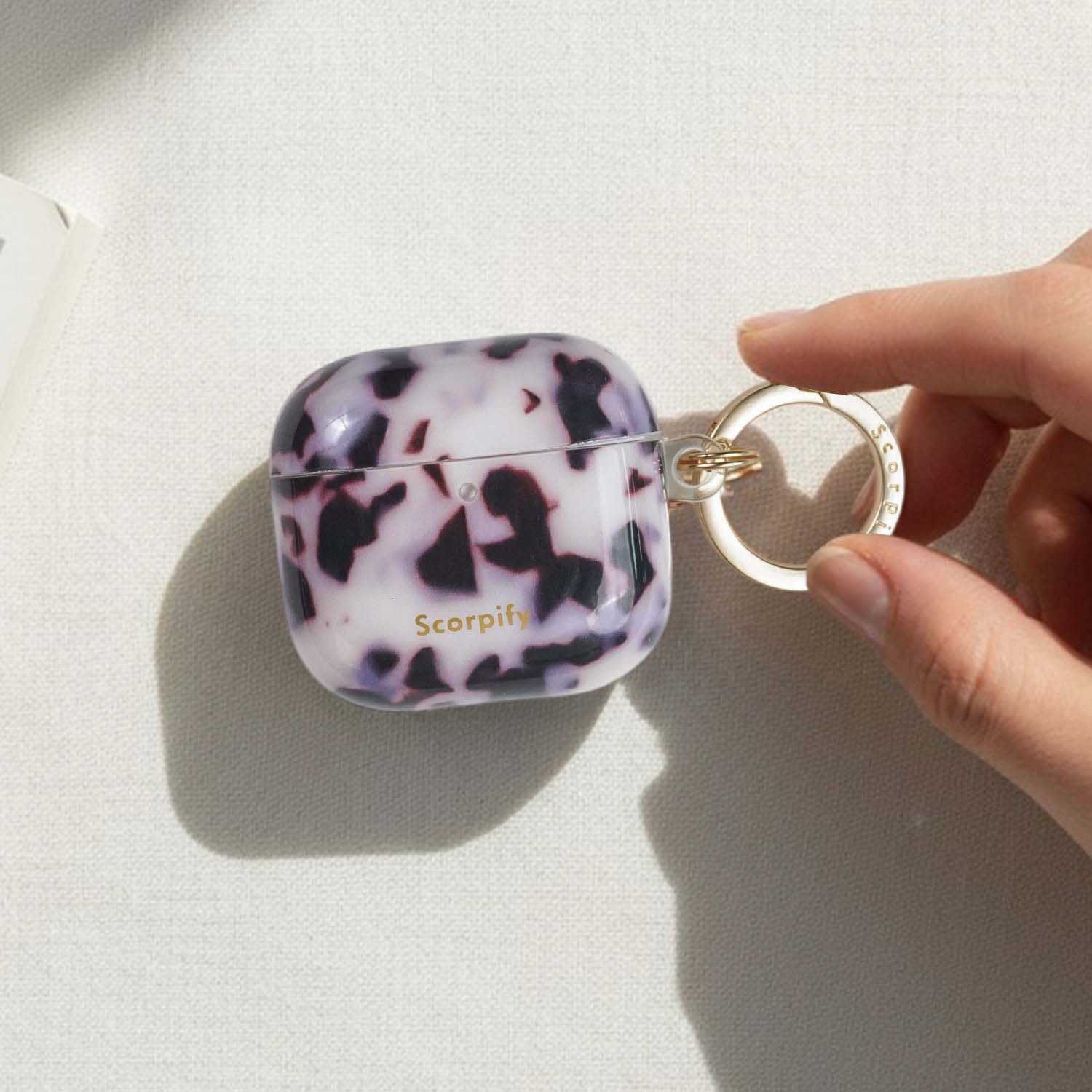 Tortoise shell airpod case cover in soft pink tones
