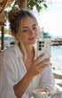 Model holding Natural Mother of Pearl Samsung Galaxy case