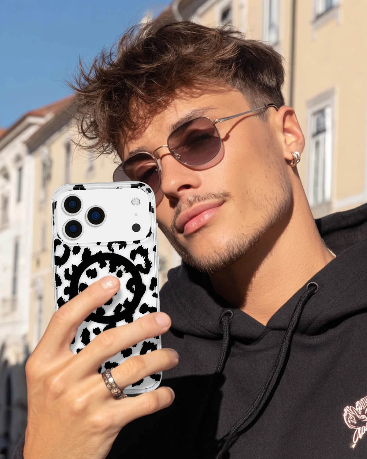 Black cheetah print iPhone 17 case with transparent finish
