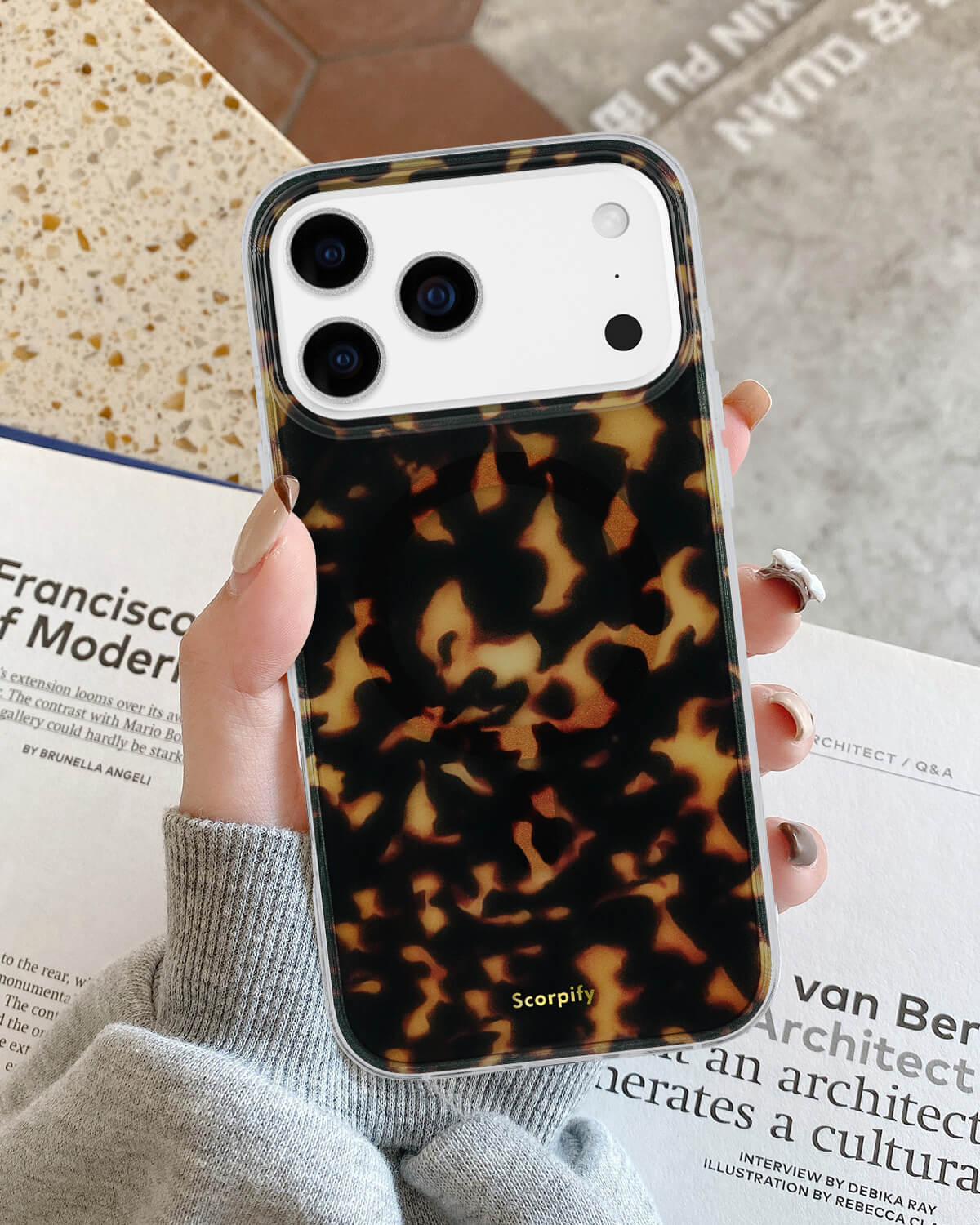 Stylish dark brown tortoise iPhone case with glossy finish