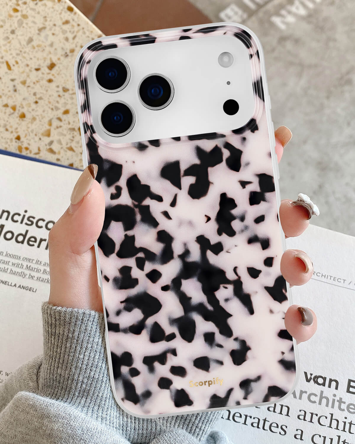 Stylish pink tortoise iPhone case with glossy finish