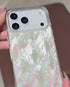 Hand holding pearl seashell textured phone case