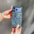 Woman's hand holding blue glitter phone case with swirl pattern