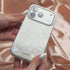 Woman holding sparkly iridescent iPhone case
