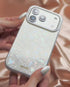 Woman holding sparkly iridescent iPhone case