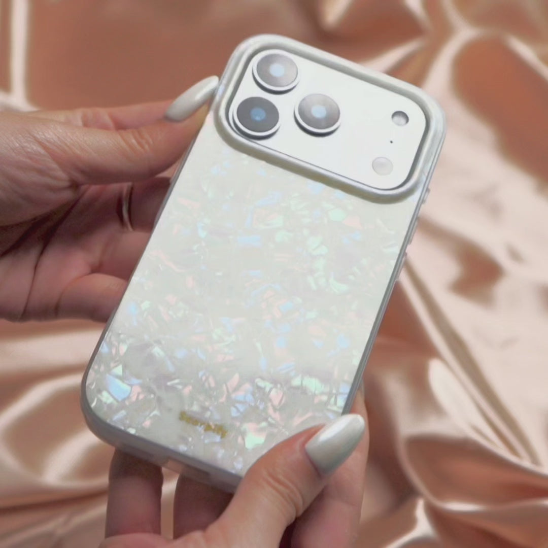 Woman holding sparkly iridescent iPhone case
