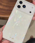 Hand holding iridescent feather pattern phone case