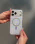 Hand holding glitter phone case with rainbow ring